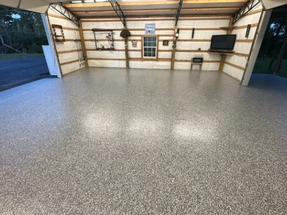 Large garage with new epoxy floor and open door