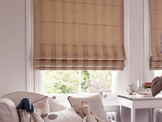 A serene room with beige blinds and plush toys