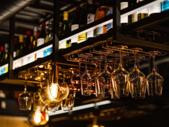 Bar with hanging wine glasses and bottles