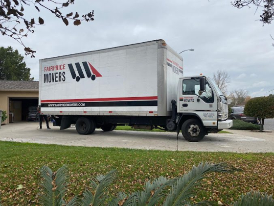Fairprice Movers truck parked outside a house