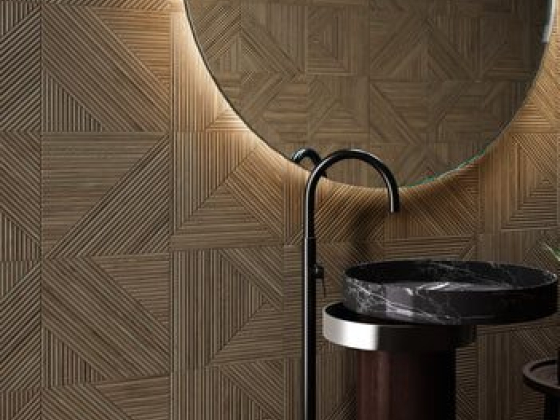 Modern sink and round mirror in stylish bathroom