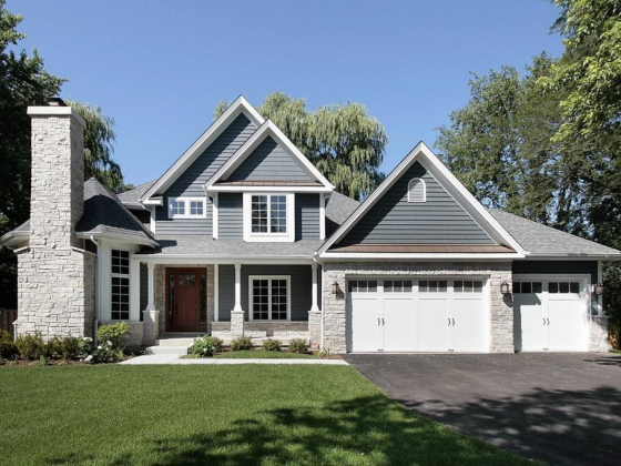 Charming house exterior with garage and chimney