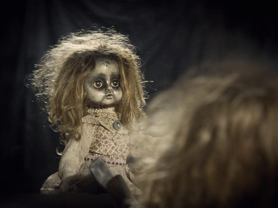 Vintage doll with a haunting appearance in the dark