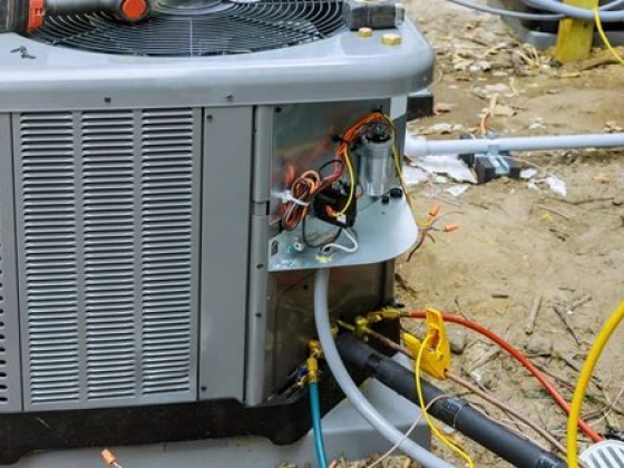 HVAC unit undergoing maintenance work outside