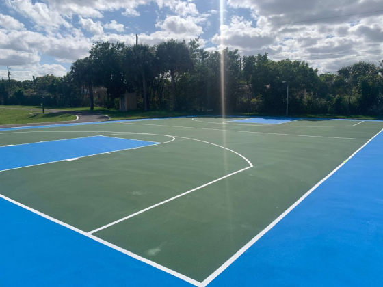 An empty basketball court with fresh paint
