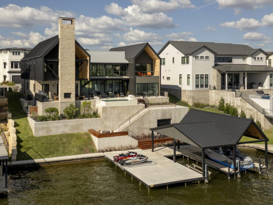 Contemporary house by the lake with private dock and boat