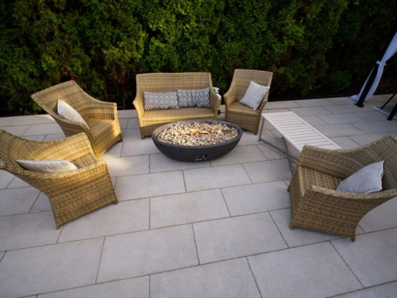 Cozy patio setup with chairs and a fire pit
