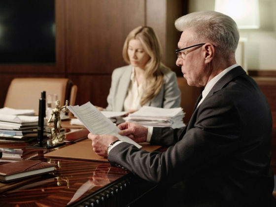 Man and woman reviewing documents in an office