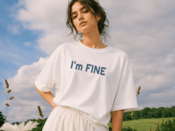 Woman standing in nature with 'I'm FINE' shirt
