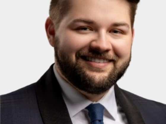 Portrait of a bearded man in a suit and tie