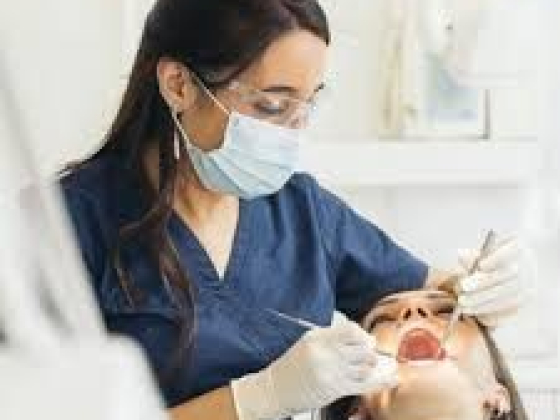 Dentist performs dental check-up on a patient