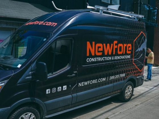 Newfore construction van with logo and contact details