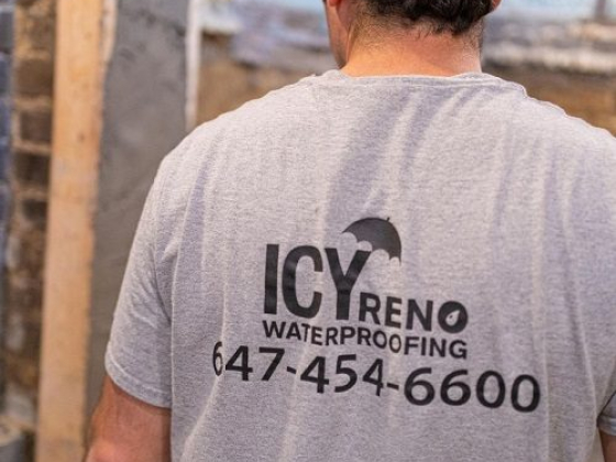 Back view of a man advertising waterproofing services
