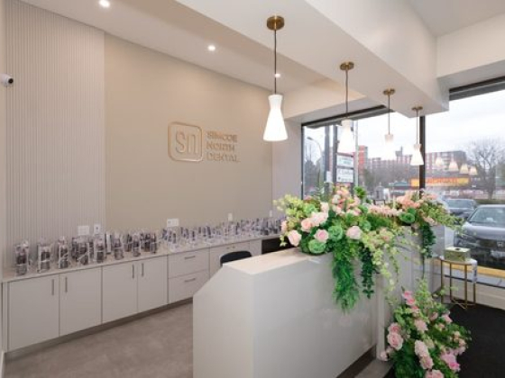 Reception area with flowers at a dental clinic entrance