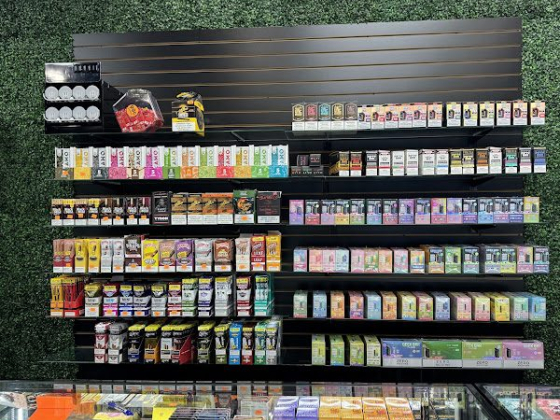 A display of assorted vape products lined on store shelves