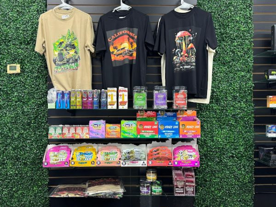 T-shirts and assorted snacks on a shop wall display