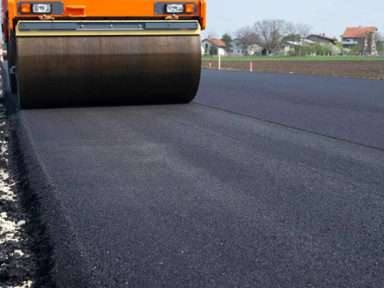 Close-up of a steamroller on fresh asphalt road