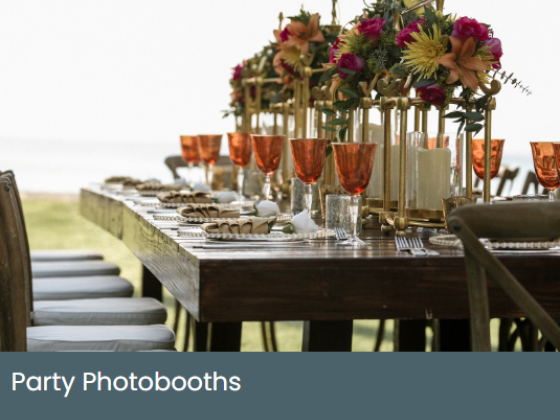 Outdoor decorated table with flowers and orange goblets