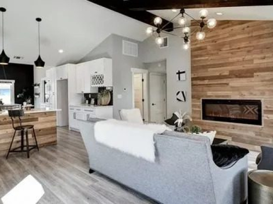 Contemporary living area with wooden accents and island kitchen