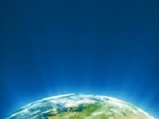 Partial view of Earth against a vast blue sky