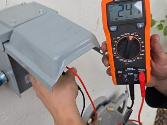 Multimeter displays 24 volts on outdoor electrical box