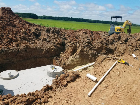 Septic tank installation in a rural excavation site