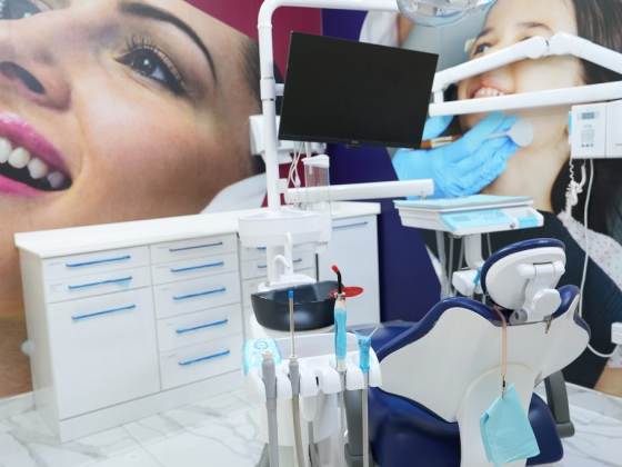 Dental office with chair, tools, and large wall images