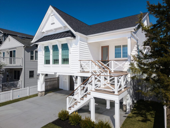 Stylish home featuring a spacious front deck.