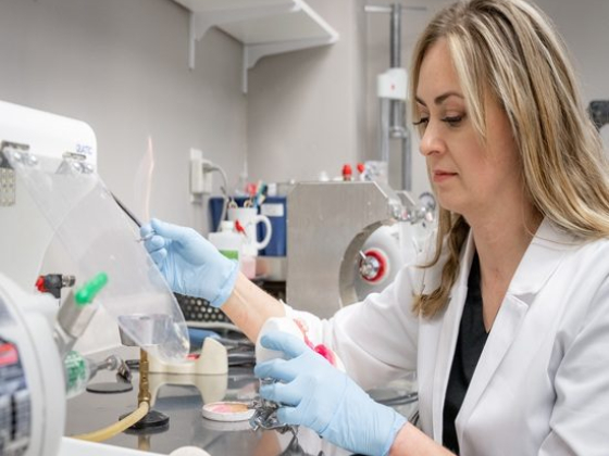 A researcher conducts experiments in a lab setting.