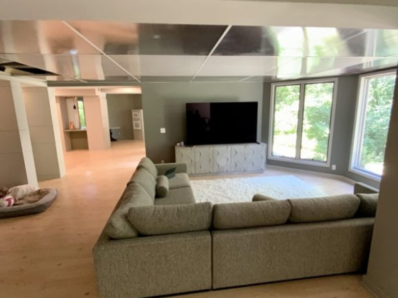 Modern living room with a sectional sofa and TV