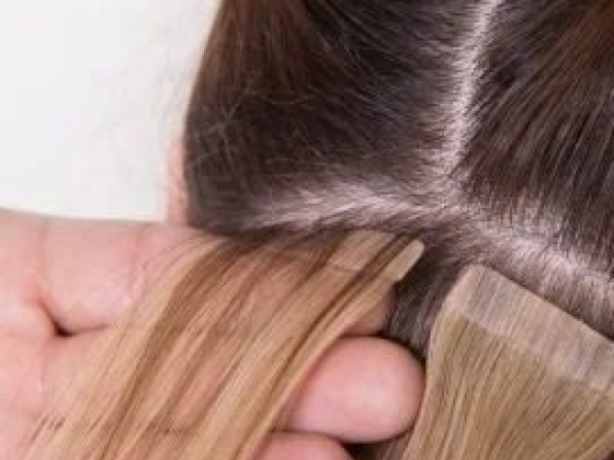 Applying tape-in hair extensions to natural hair