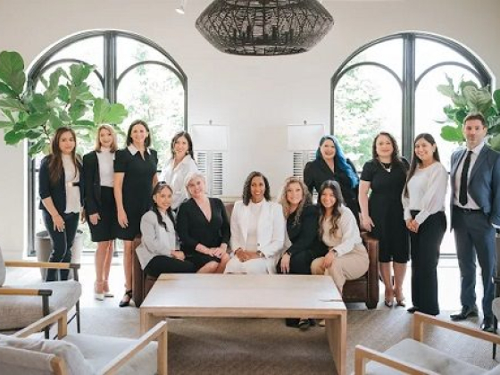 Team gathered in a stylish, modern office setting