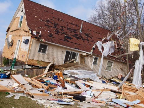 Severely damaged house after a natural disaster