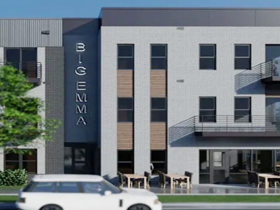 Facade of a contemporary building named 'BIG EMMA'