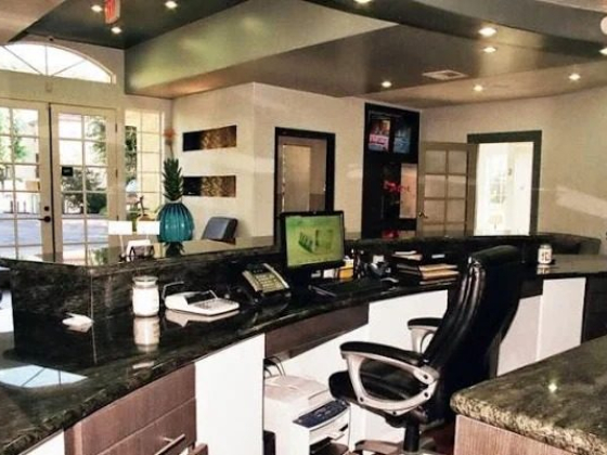 Spacious office lobby with a central reception desk
