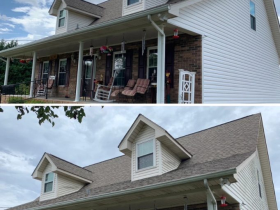 A brick and siding house with front seating and hanging plants