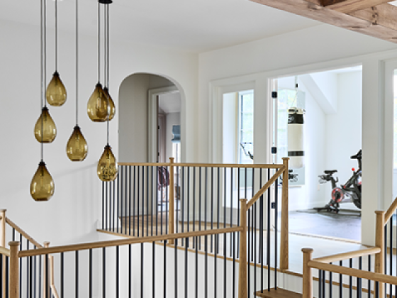 Elegant open-plan staircase with unique lighting design