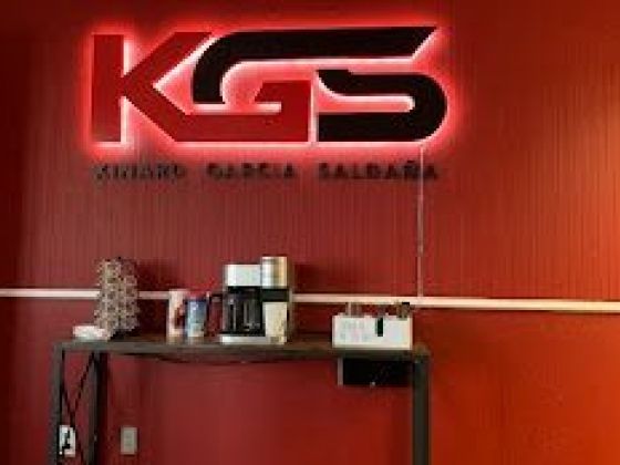 Coffee station under KGS neon sign in red room