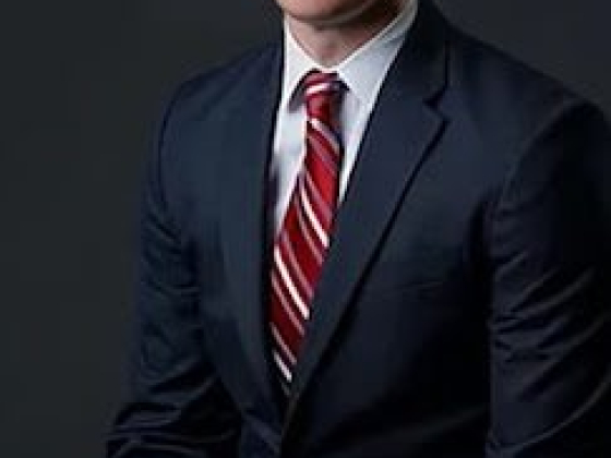 Professional portrait of a man in business attire