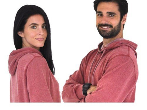 A couple wearing matching red hoodies smiling