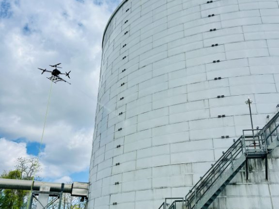 Drone conducts inspection near a water storage tank