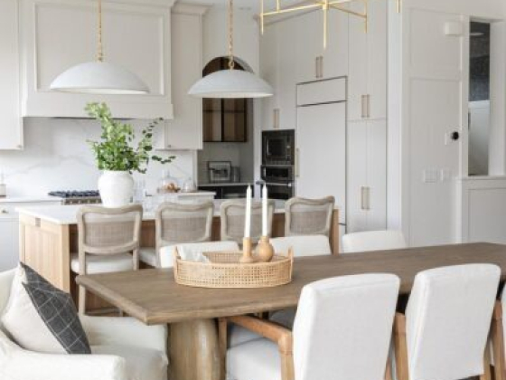 Spacious dining area with wood table and light fixtures