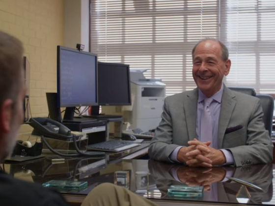 Businessman engaged in conversation at his desk