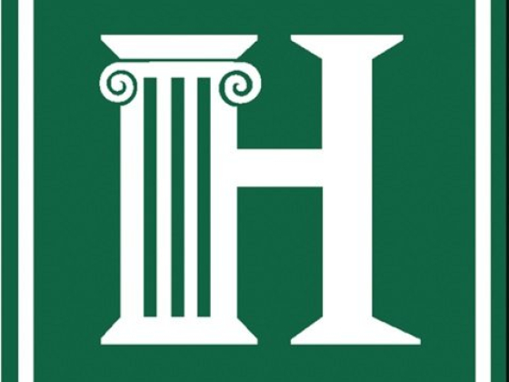 Green background with white H and column