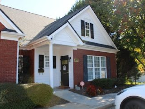 Charming house with red brick and black shutters