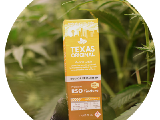 RSO Tincture box held in front of cannabis plants