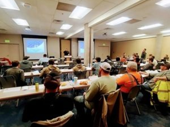 Attendees watching a lecture in a conference room