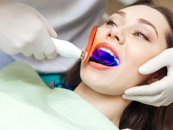 Patient receiving laser treatment at dental clinic