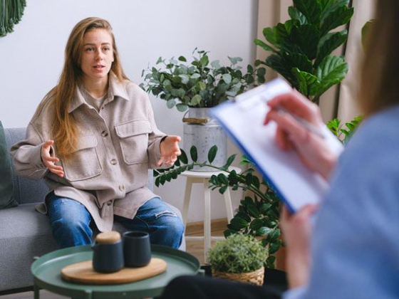 A therapy session with a therapist and a client
