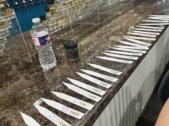 Perfume samples with test strips on counter